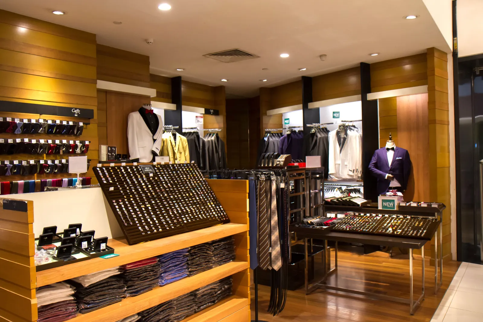 A Cuffz menswear counter with shirts, neckties and cufflinks on display